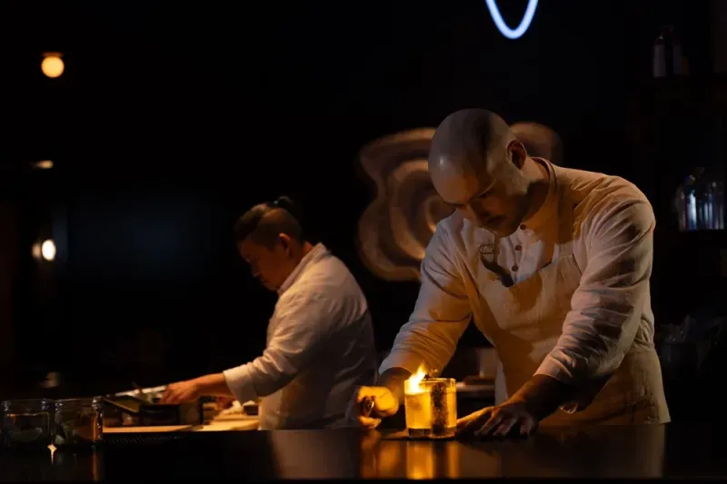 Chef preparing fish for service at The Naisho Room